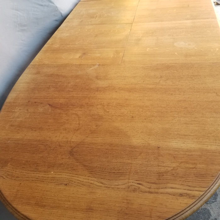 OAK OVAL DINING TABLE WITH TURNED LEGS AND POP UP LEAF