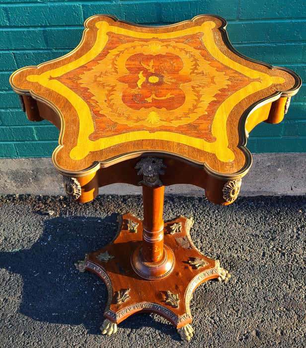 INLAID SCALLOPED TOP PEDESTAL TABLE WITH BRASS FIGURAL ORMOLU