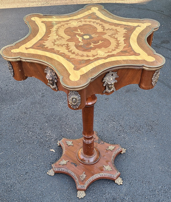 INLAID SCALLOPED TOP PEDESTAL TABLE WITH BRASS FIGURAL ORMOLU