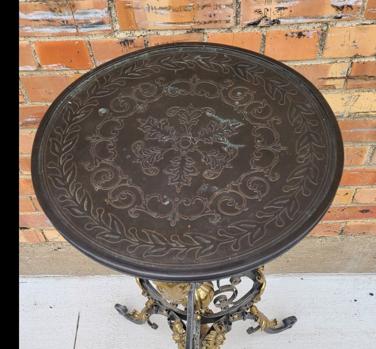 ORNATE IRON AND BRASS STAND WITH EMBOSSED METAL TOP