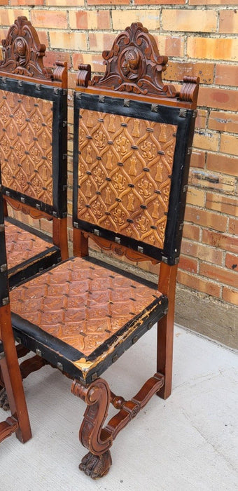 PAIR OF LEATHER SEAT KNIGHT THEME CHAIRS