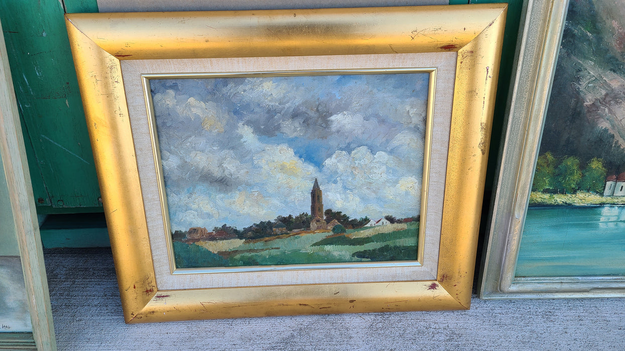 OIL PAINTING OF A CHURCH ON A HILL WITH GREAT CLOUDS