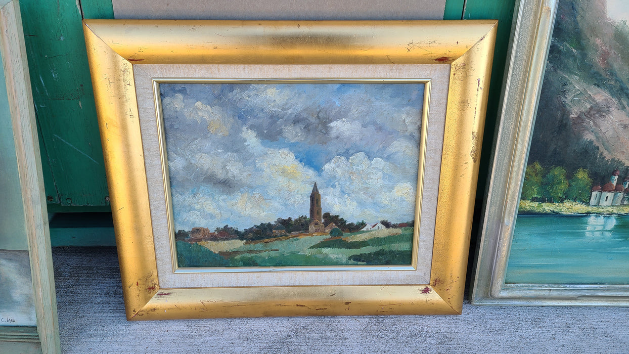 OIL PAINTING OF A CHURCH ON A HILL WITH GREAT CLOUDS