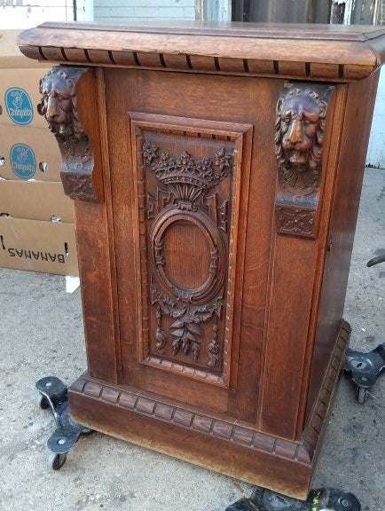 LARGE CARVED PEDESTAL WITH DOOR