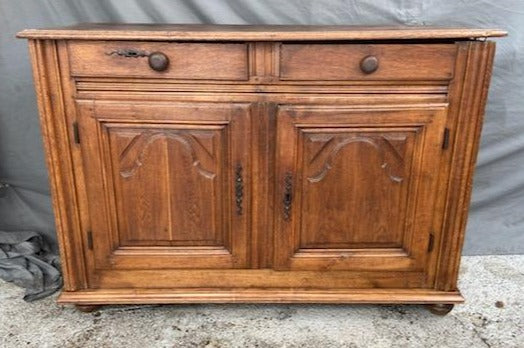 EARLY FRENCH OAK SERVER WITH ARCHED PANEL DOORS AND KNOB HANDLES