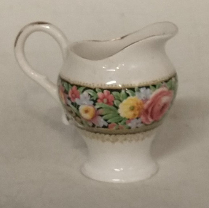 SMALL PAINTED PORCELAIN PITCHER