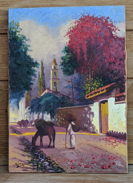 UNFRAMED OIL PAINTING OF  MEXICAN VILLAGE WITH MAN AND DONKEY ON BOARD [