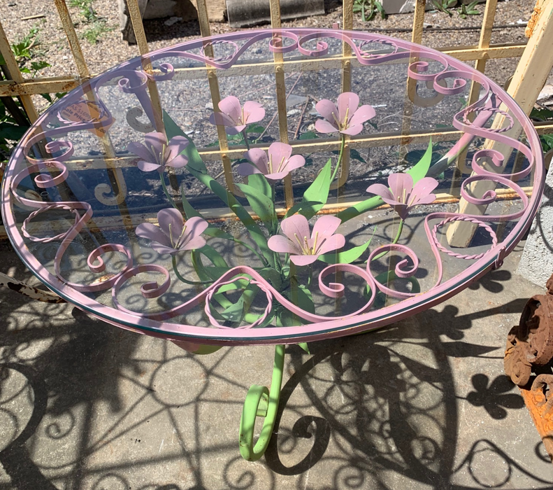 SMALL PINK AND GREEN PAINTED METAL FLORAL PATIO TABLE WITH GLASS TOP