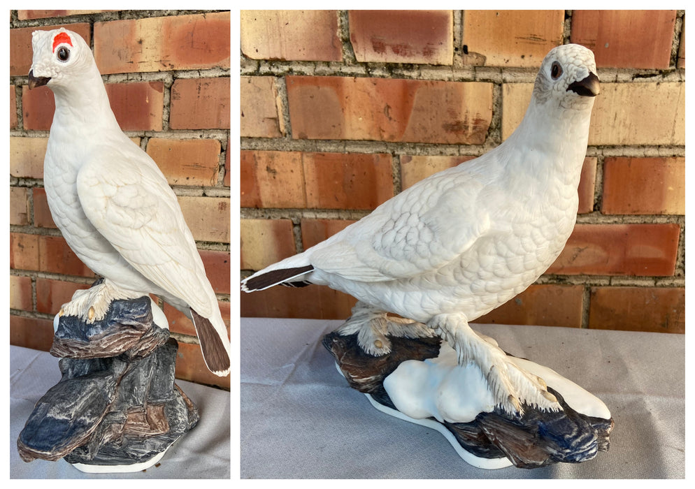 PAIR OF PORCELAIN ARCTIC BIRD STATUES ON ROCKS