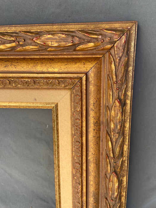 GOLD FRAME WITH OUTER LAURELING AND LINEN LINER