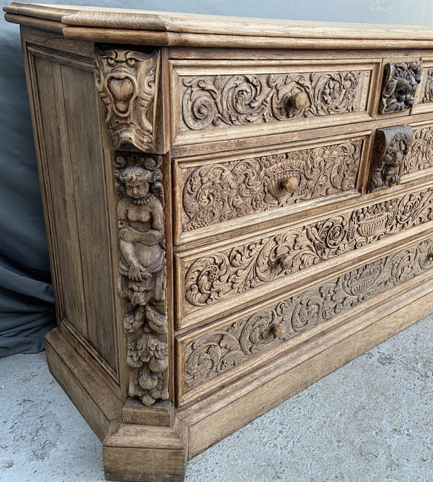 LARGE FIGURAL CARVED RAW OAK CHEST WITH DESK