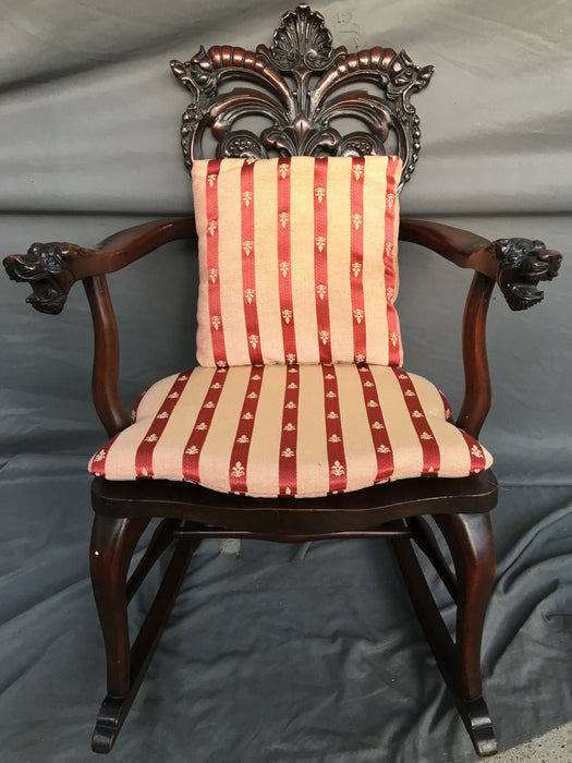 AMERICAN MAHOGANY ROCKING CHAIR WITH LIONS HEAD ARMS AND RED STRIPED CUSHIONS