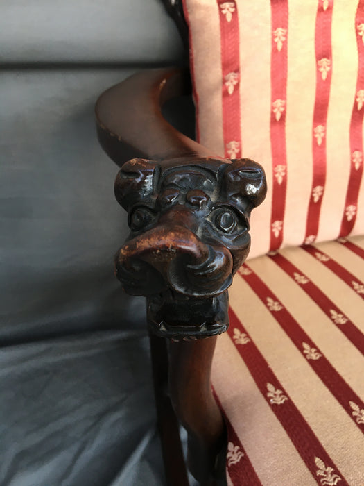 AMERICAN MAHOGANY ROCKING CHAIR WITH LIONS HEAD ARMS AND RED STRIPED CUSHIONS