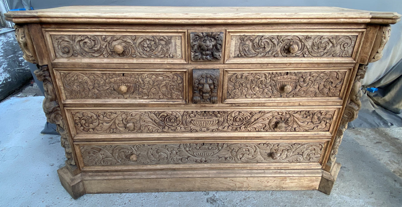 LARGE FIGURAL CARVED RAW OAK CHEST WITH DESK