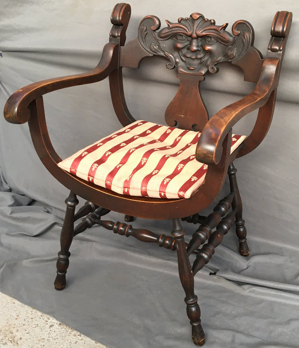 1910 MAHOGANY SAVANAROLA MUSIC CHAIR WITH FACE CARVED IN BACK