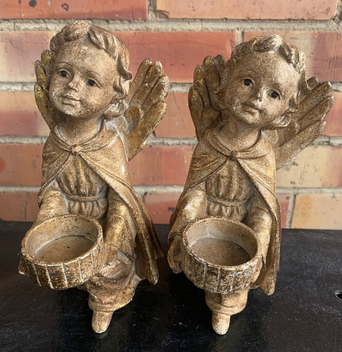 PAIR OF GOLD COMPOSITION ANGEL CANDLE HOLDERS