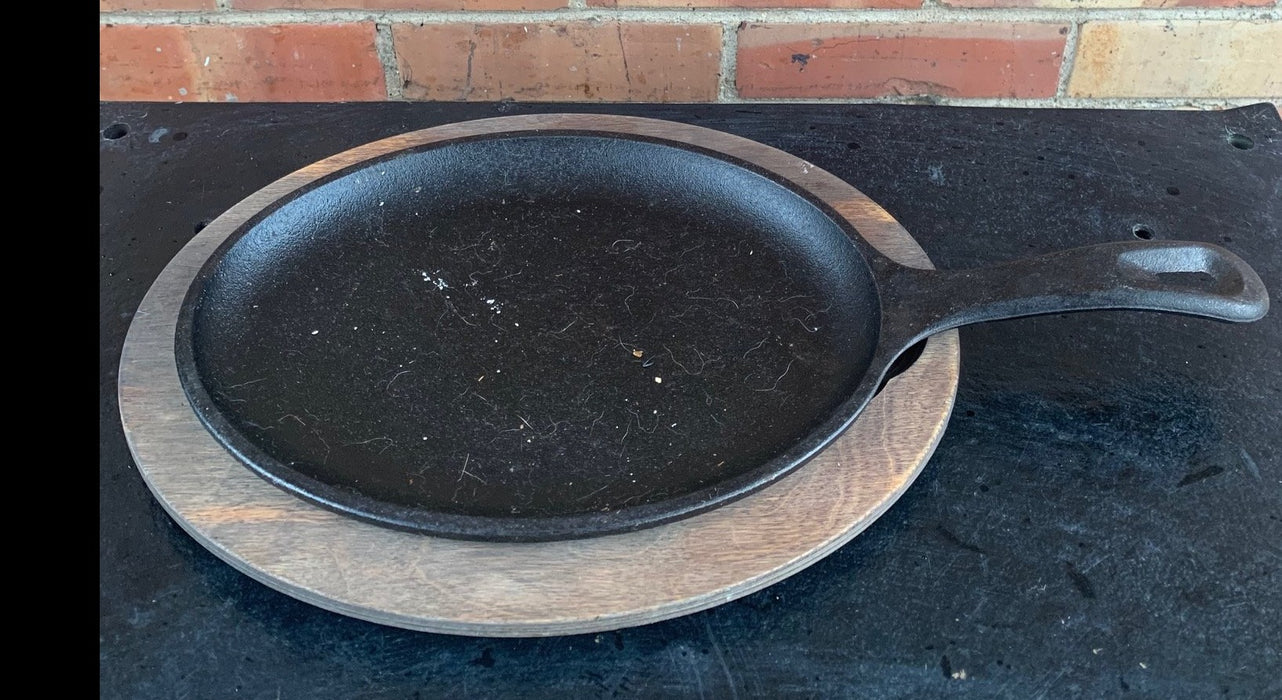 OVAL CAST IRON HANDLED PAN WITH WOOD BASE