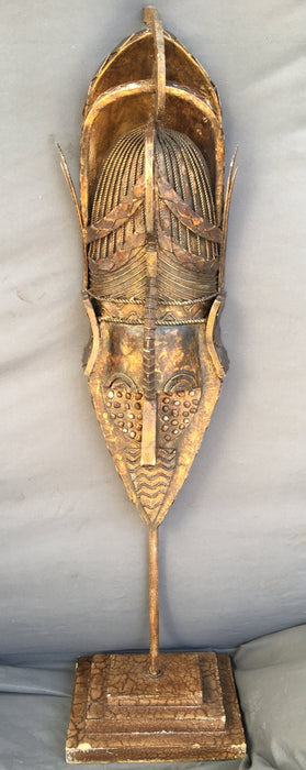 GOLD METAL MASK ON STAND