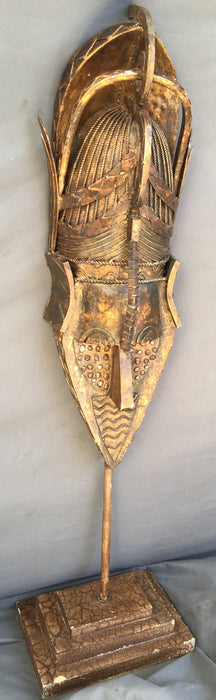 GOLD METAL MASK ON STAND