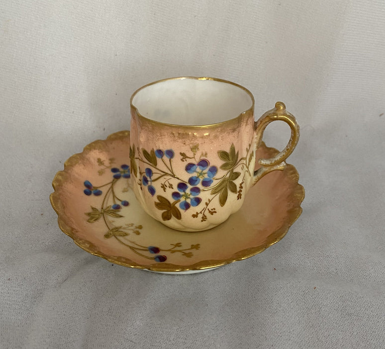 PINK 'LIMOGES FRANCE' DEMITASSE WITH BLUE AND GOLD FLOWERS AND SAUCER