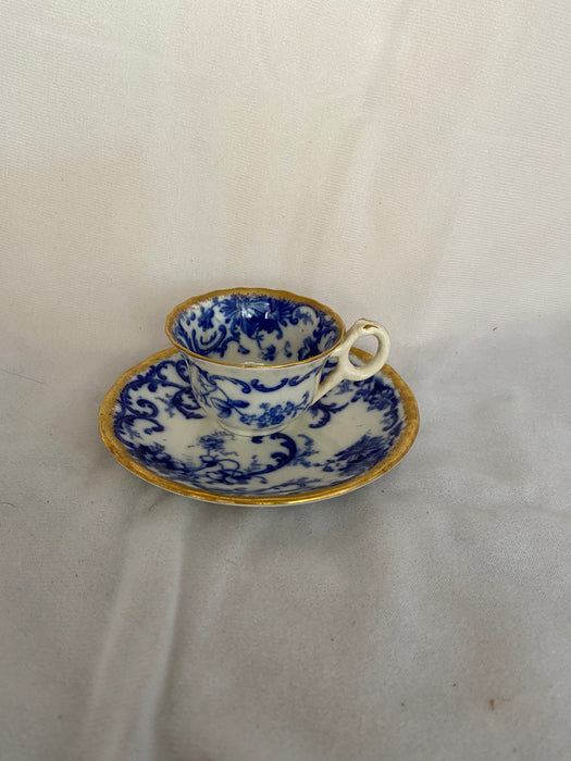 'BAULDON' BLUE AND WHITE DEMITASSE WITH GOLD OUTLINE AND SAUCER