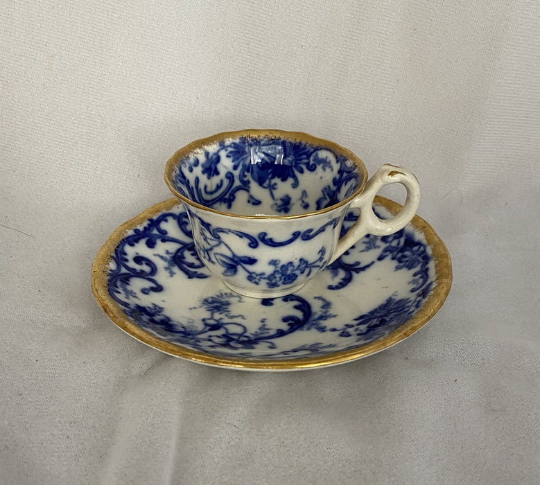 'BAULDON' BLUE AND WHITE DEMITASSE WITH GOLD OUTLINE AND SAUCER