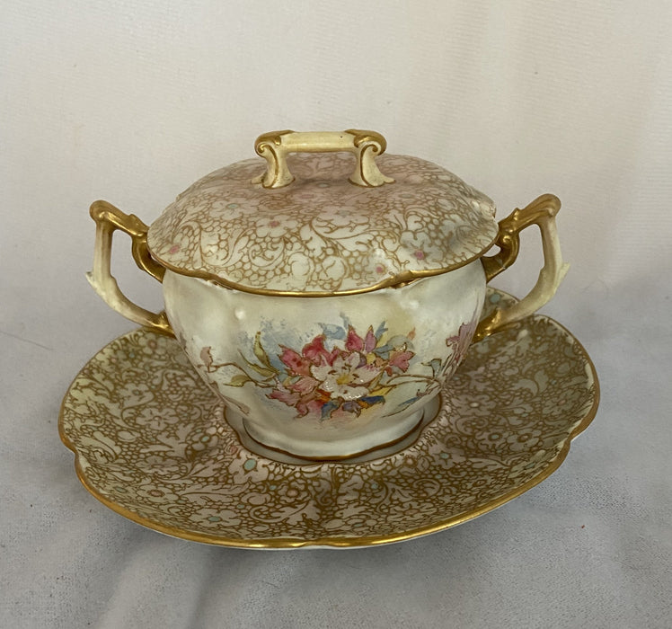 'DOULTON BURSLEM' HAND-PAINTED PALE WHITE AND GOLD FLORAL SUGAR WITH SAUCER