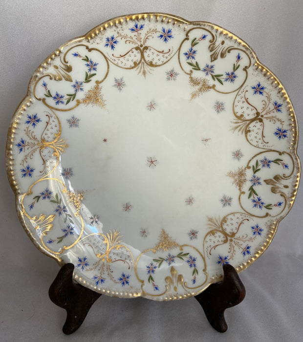 FRENCH LIMOGES PLATE WITH GOLD OUTLINE AND BLUE FLOWERS