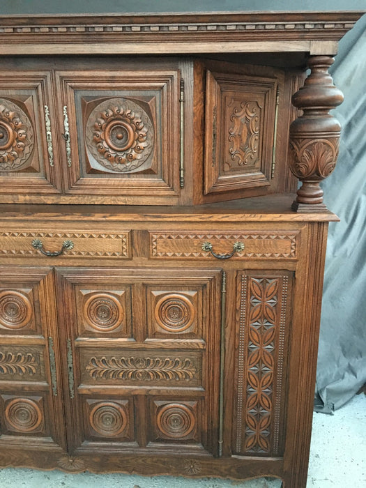 RENAISSANCE REVIVAL CARVED OAK COURT CUPBOARD WITH FOLIATE AND ROSETTE CARVED ACCENTS