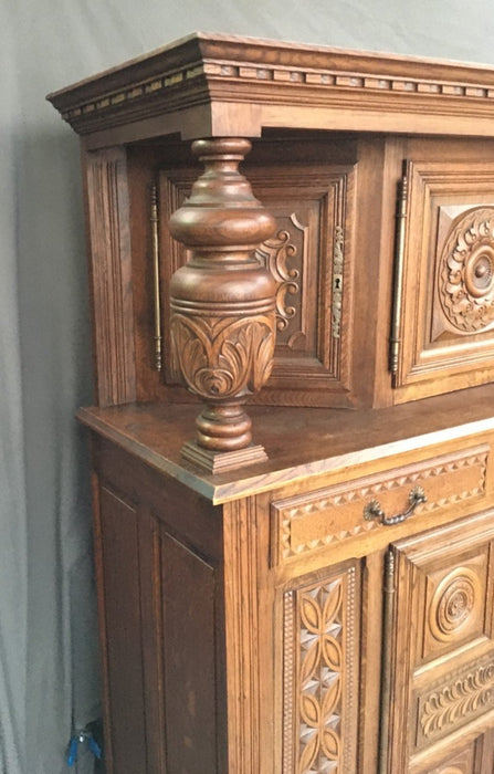 RENAISSANCE REVIVAL CARVED OAK COURT CUPBOARD WITH FOLIATE AND ROSETTE CARVED ACCENTS
