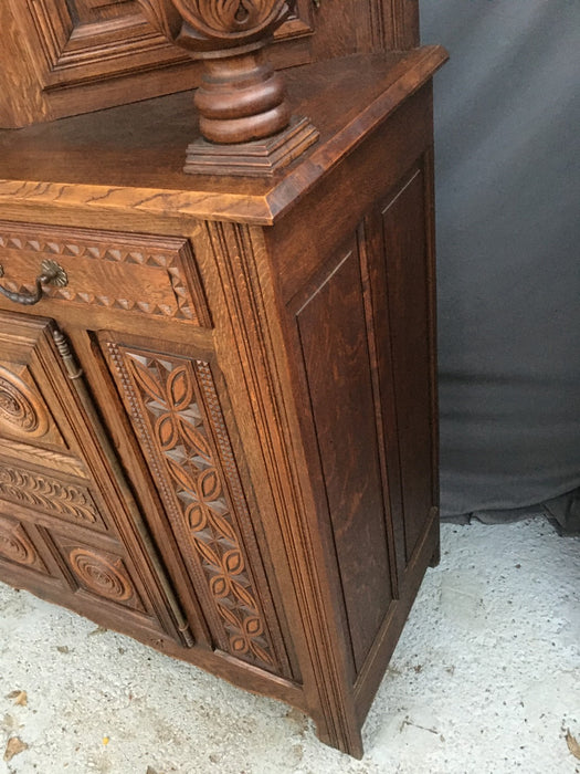 RENAISSANCE REVIVAL CARVED OAK COURT CUPBOARD WITH FOLIATE AND ROSETTE CARVED ACCENTS