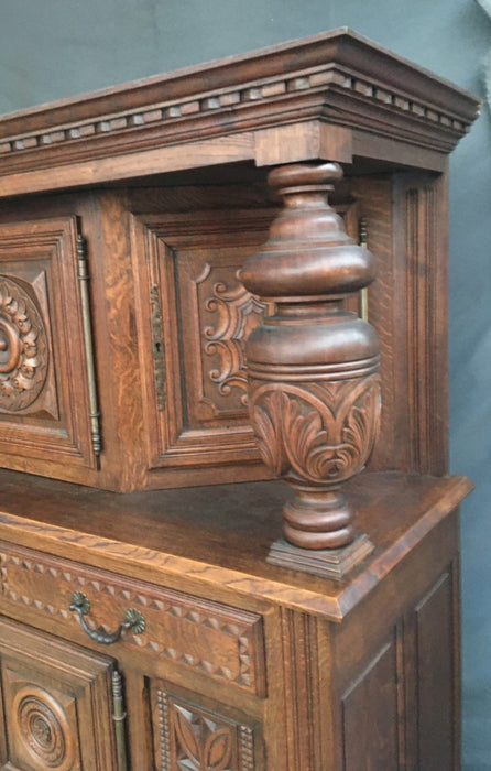RENAISSANCE REVIVAL CARVED OAK COURT CUPBOARD WITH FOLIATE AND ROSETTE CARVED ACCENTS