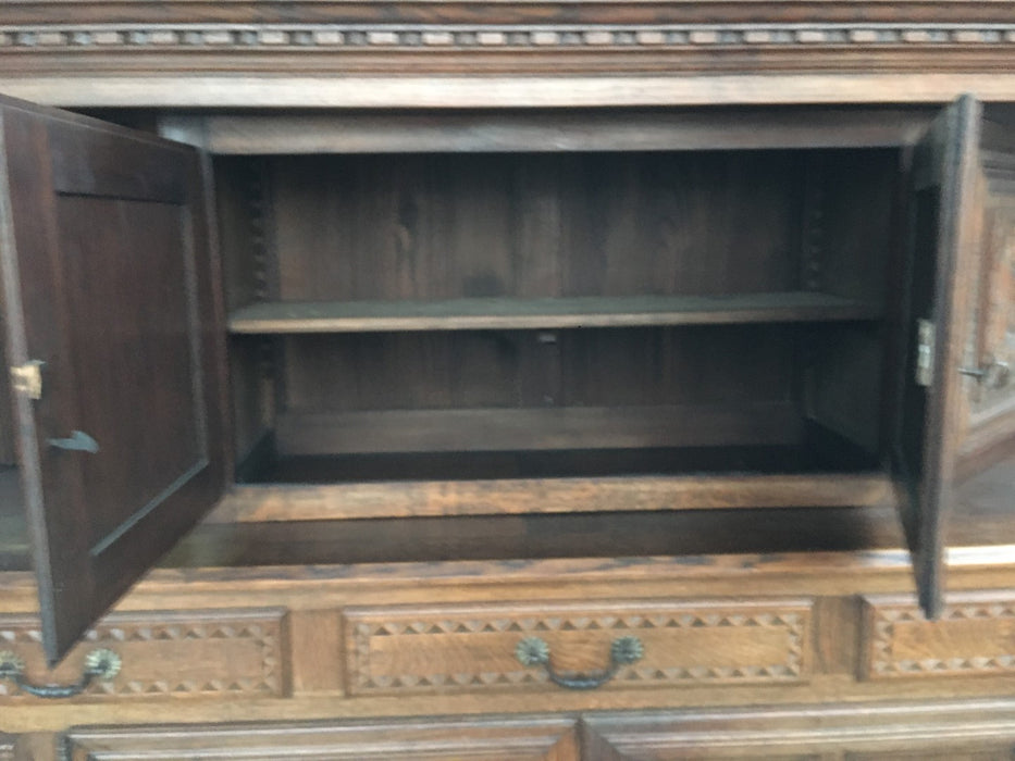 RENAISSANCE REVIVAL CARVED OAK COURT CUPBOARD WITH FOLIATE AND ROSETTE CARVED ACCENTS
