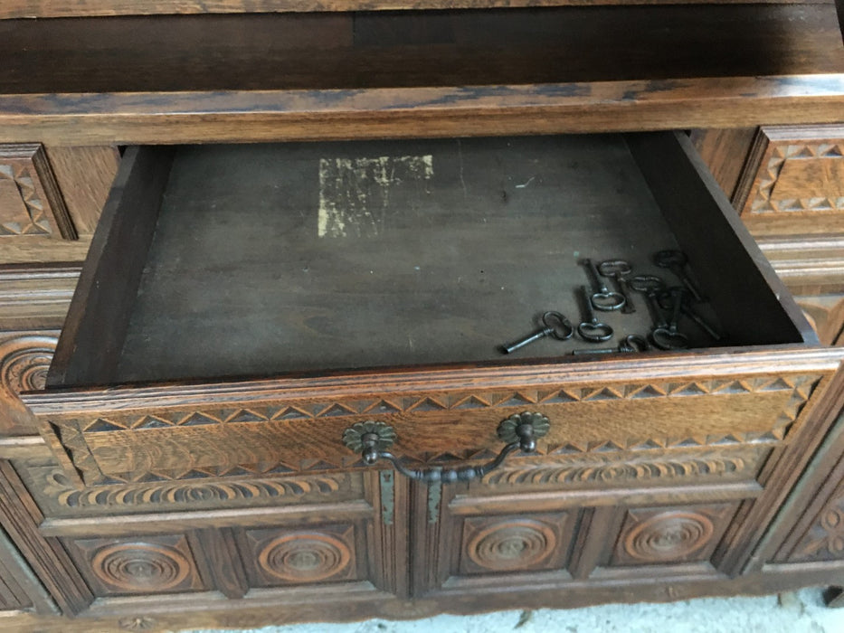 RENAISSANCE REVIVAL CARVED OAK COURT CUPBOARD WITH FOLIATE AND ROSETTE CARVED ACCENTS
