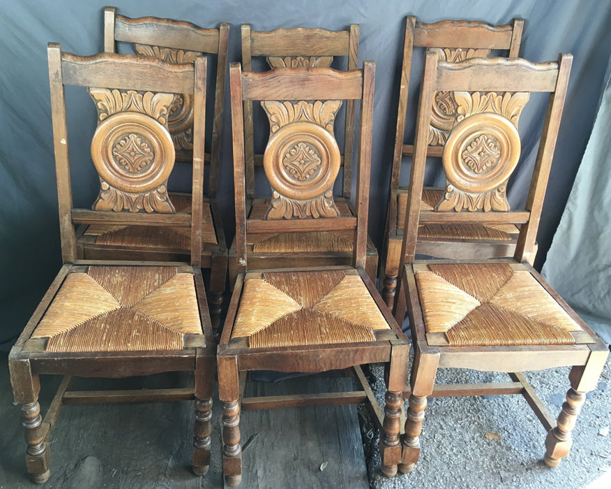 SET OF 6 NEO RENAISSANCE OAK CHAIRS WITH ROSETTE CARVED BACKS AND RUSH WOVEN SEATS