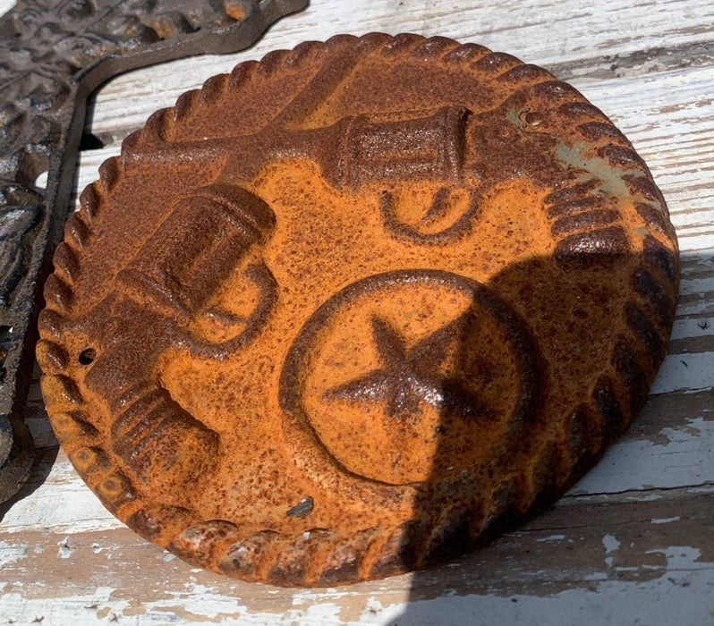 RUSTY CAST IRON GUN AND STAR PLAQUE