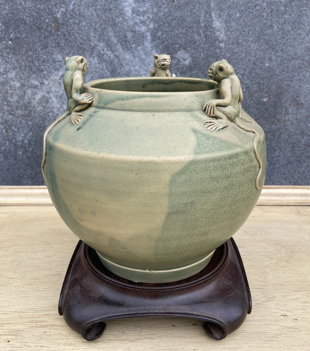 VINTAGE CHINESE CELADON JAR WITH APPLIED MONKEYS ON WOOD STAND