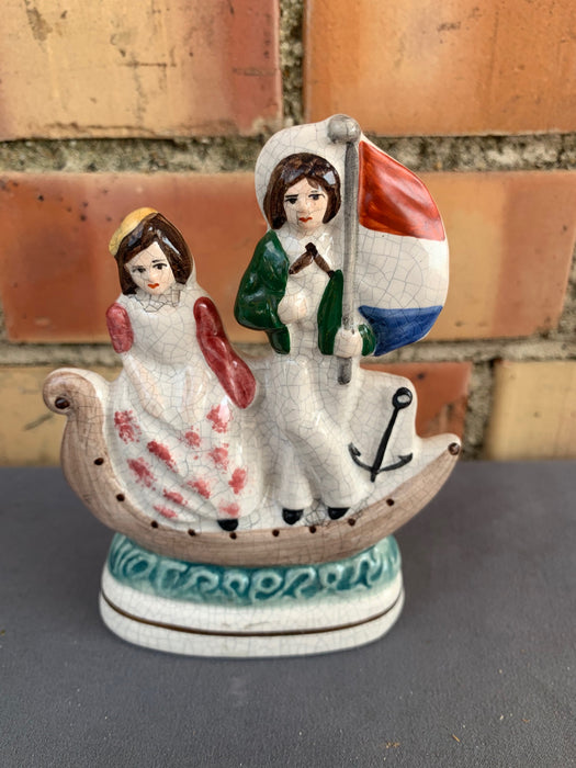 SMALL STAFFORDSHIRE COUPLE IN BOAT