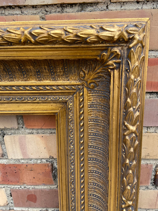 HEAVY GILT FRAME WITH LAURELING