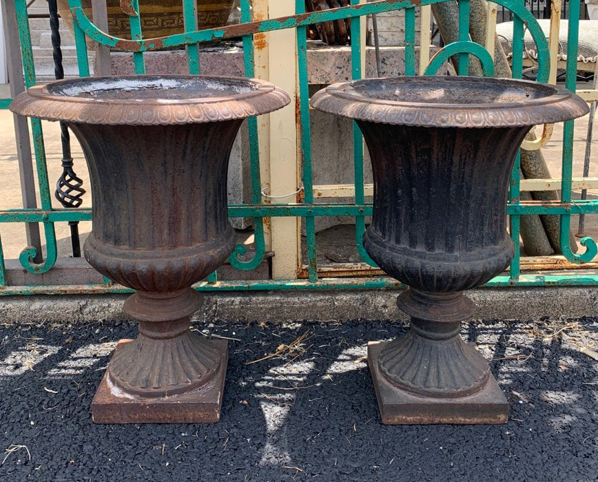 PAIR OF FULL IRON POTS