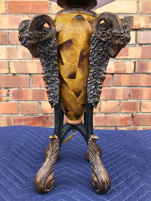 AMBER COLORED LAMP WITH ACANTHUS FEET AND RAM HEADS