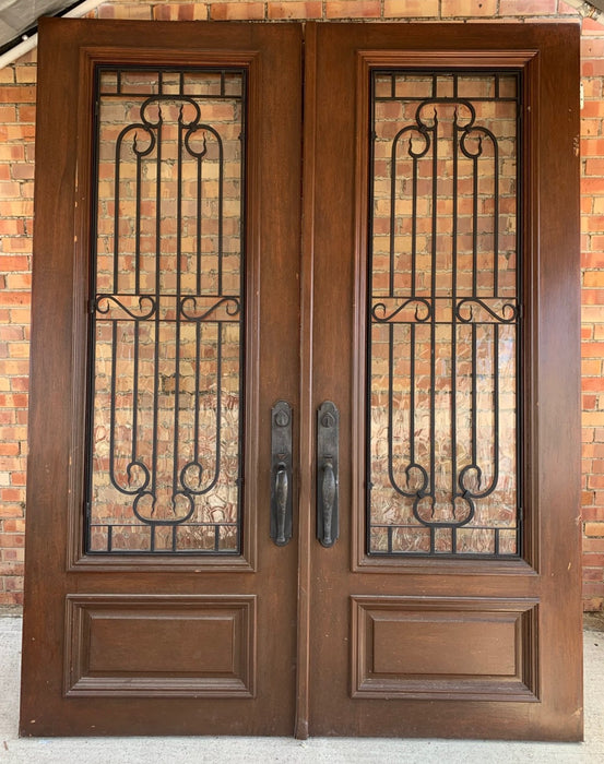 PAIR OF LARGE MAHOGANY DOORS WITH IRON INSERTS