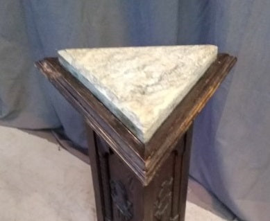 TRIANGULAR MARBLE TOP PEDESTAL WITH KNIGHTS