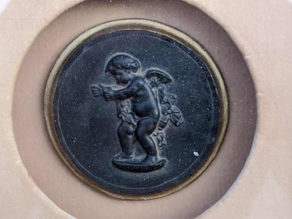 PAIR OF FRAMED COMPOSITION PUTTI CAMEOS