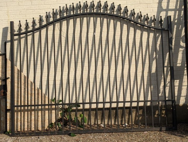 TALL ARCHED IRON GATE WITH FINIALS
