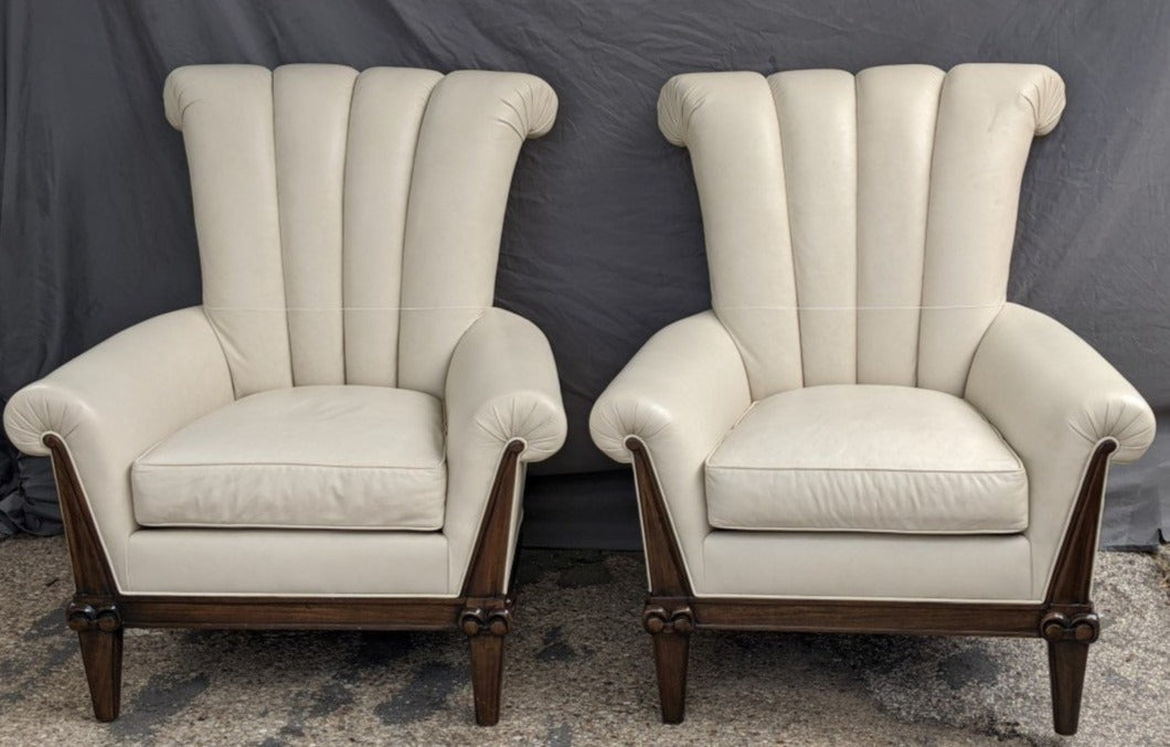 PAIR OF OVERSIZE LEATHER ARM CHAIRS WITH CHANNEL BACKS