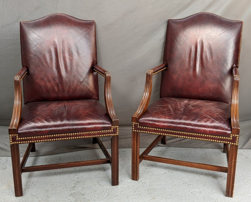 PAIR OF RED LEATHER OFFICE CHAIRS