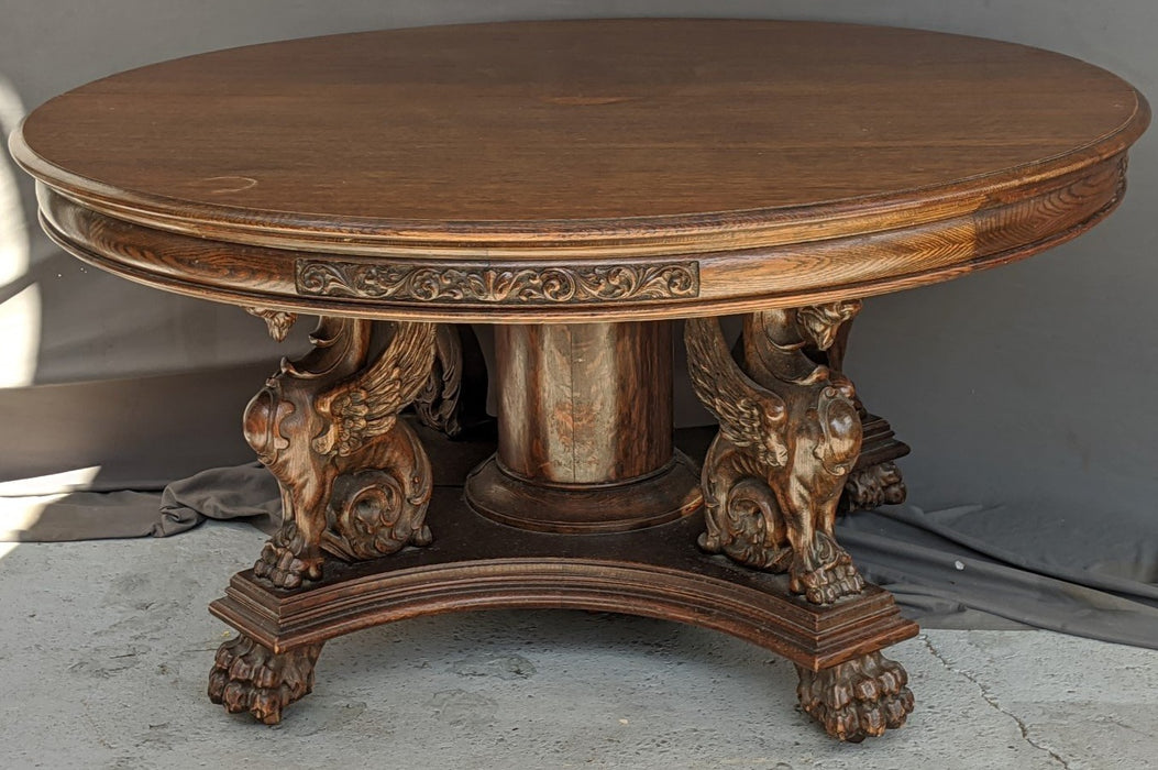 R.J. HORNER FULL GRIFFINS ROUND OAK TABLE WITH 5 LEAVES