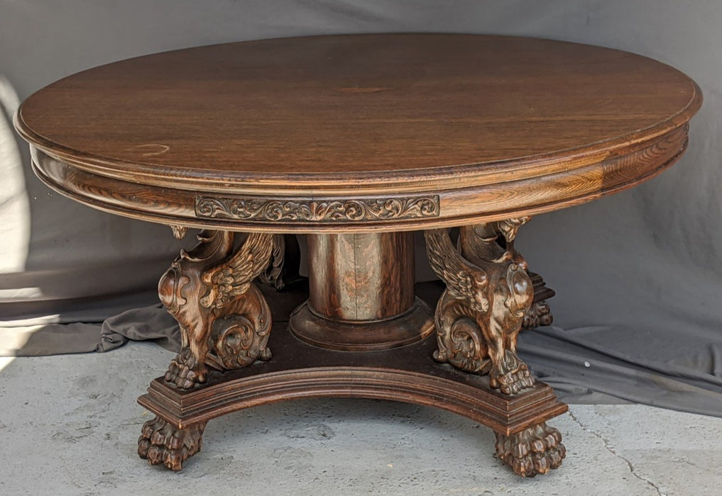 R.J. HORNER FULL GRIFFINS ROUND OAK TABLE WITH 5 LEAVES
