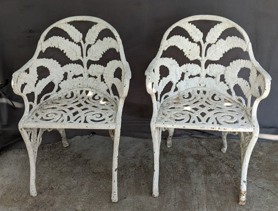 PAIR OF CAST IRON ARM CHAIRS WITH FERN LEAF BACKS